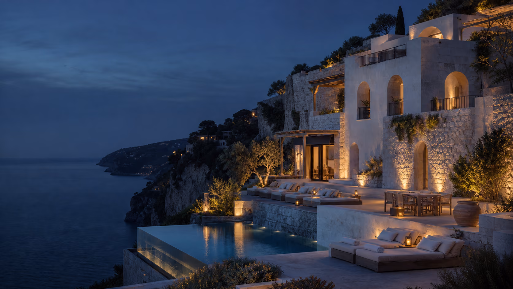 A cliffside MotionHotel at blue hour